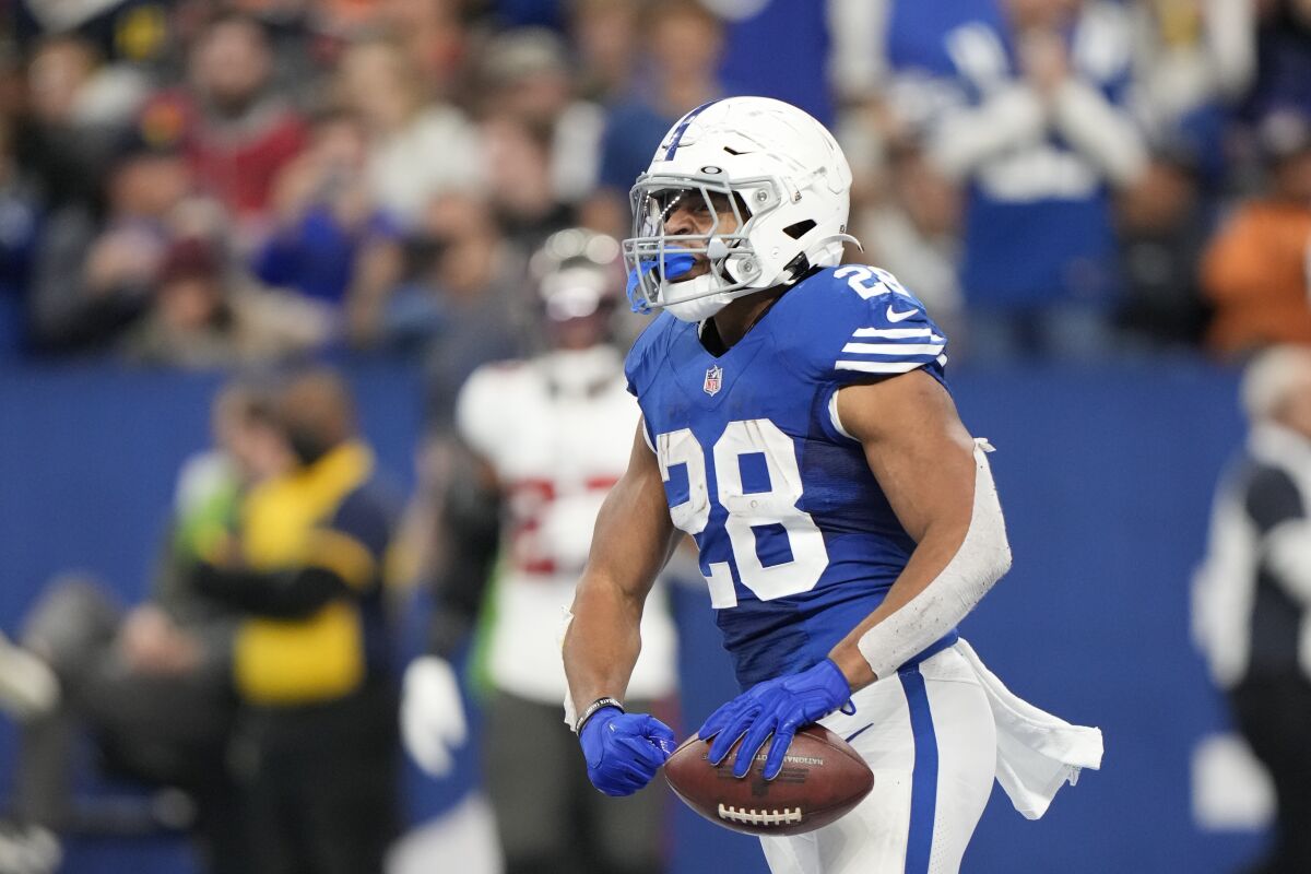Indianapolis Colts' Jonathan Taylor reacts after a touchdown run during the second half of an NFL football game against the Tampa Bay Buccaneers, Sunday, Nov. 28, 2021, in Indianapolis. (AP Photo/AJ Mast)