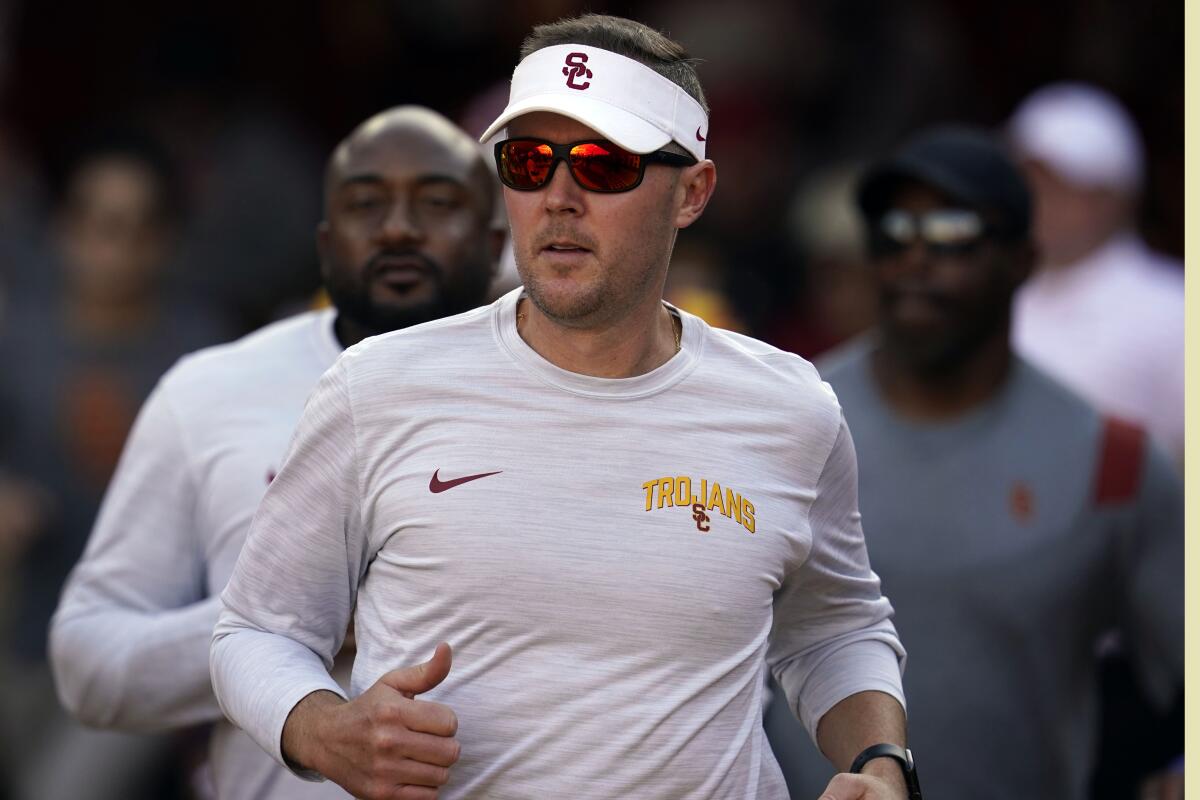 USC coach Lincoln Riley runs onto the field during a game against Washington State on Oct. 8.