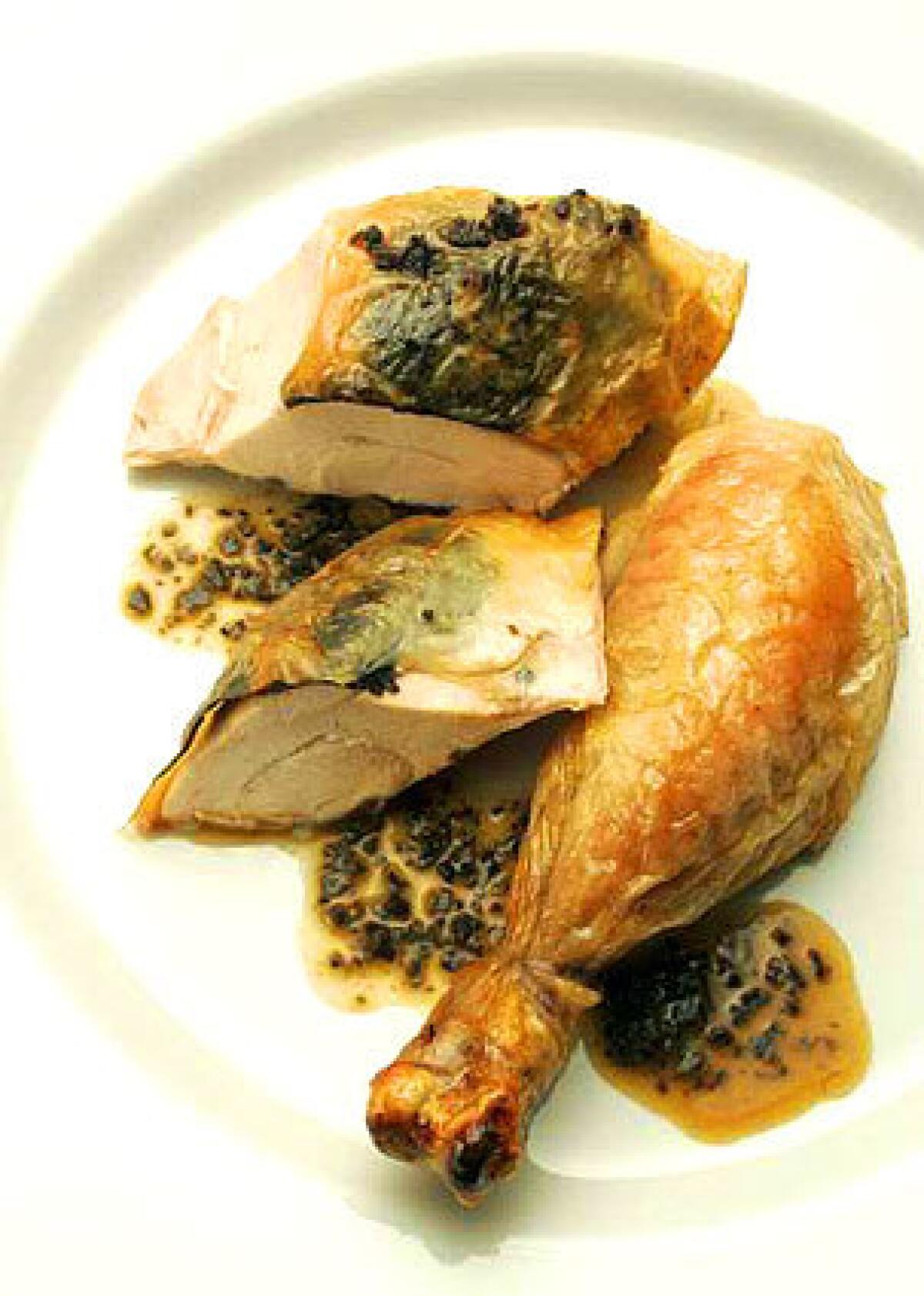 Roasted chicken with truffles and truffle butter.