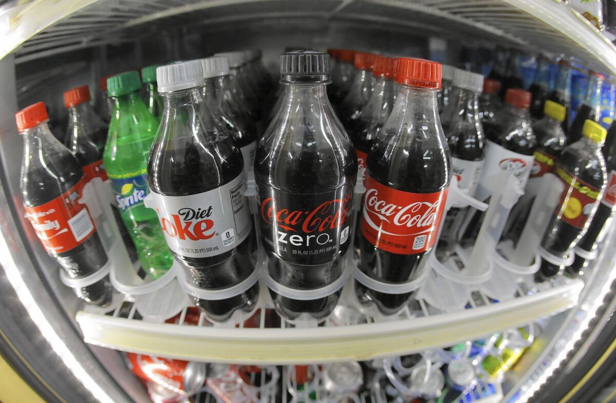 A shelf of soft drinks are shown in a refrigerator at the K & D Market in San Francisco on Oct. 1.