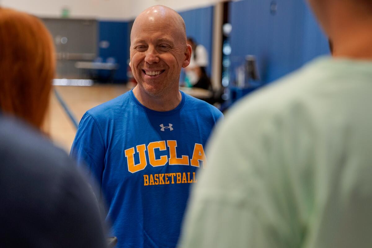 UCLA Bruins head coach Mick Cronin speaks with reporters before practice at the Mo Ostin Basketball Center on in Westwood.
