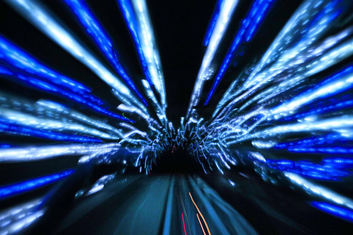 A first-person view of streaming lights while riding on the updated Hyperspace Mountain at Disneyland.