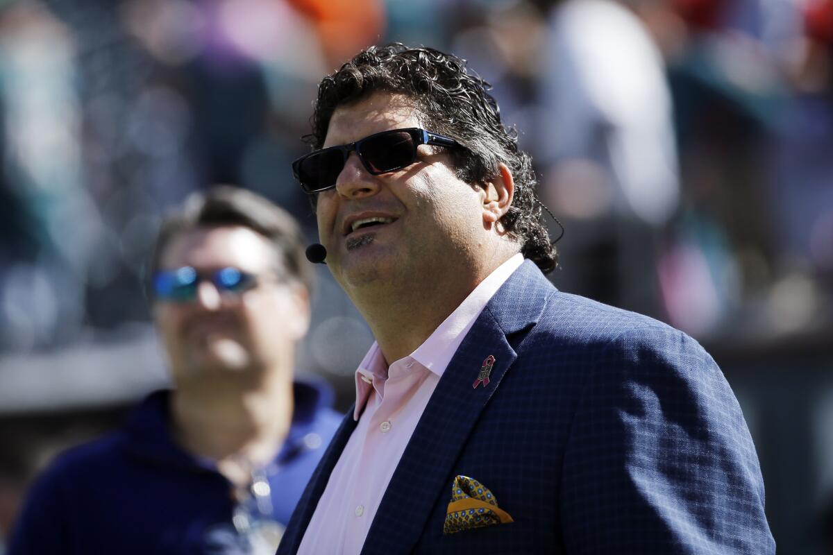 Fox Sports reporter Tony Siragusa stands on the sideline during a game.
