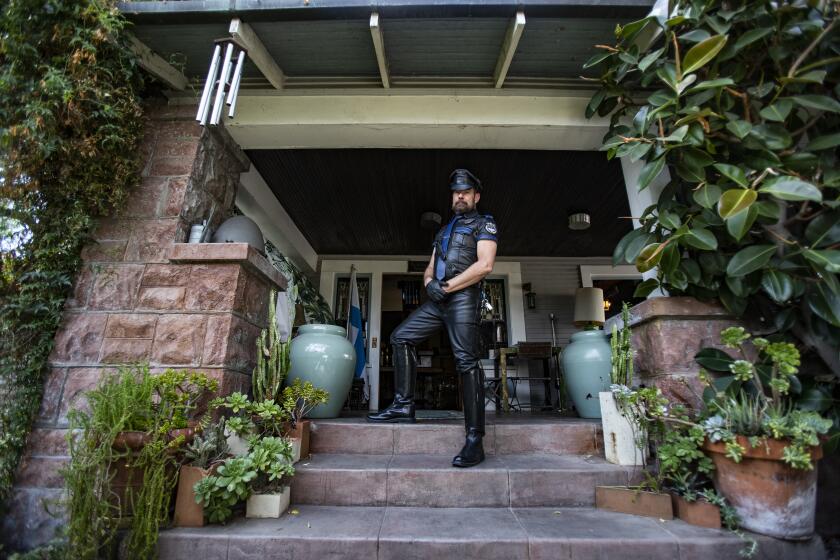 LOS ANGELES, CA - SEPTEMBER 19, 2019: Curator Marc Ransdell Bellenger stands on the steps of the Tom of Finland home on September 19, 2019 in Los Angeles, California. Finland was a homoerotic artist and the home is now a museum of his work.(Gina Ferazzi/Los AngelesTimes)