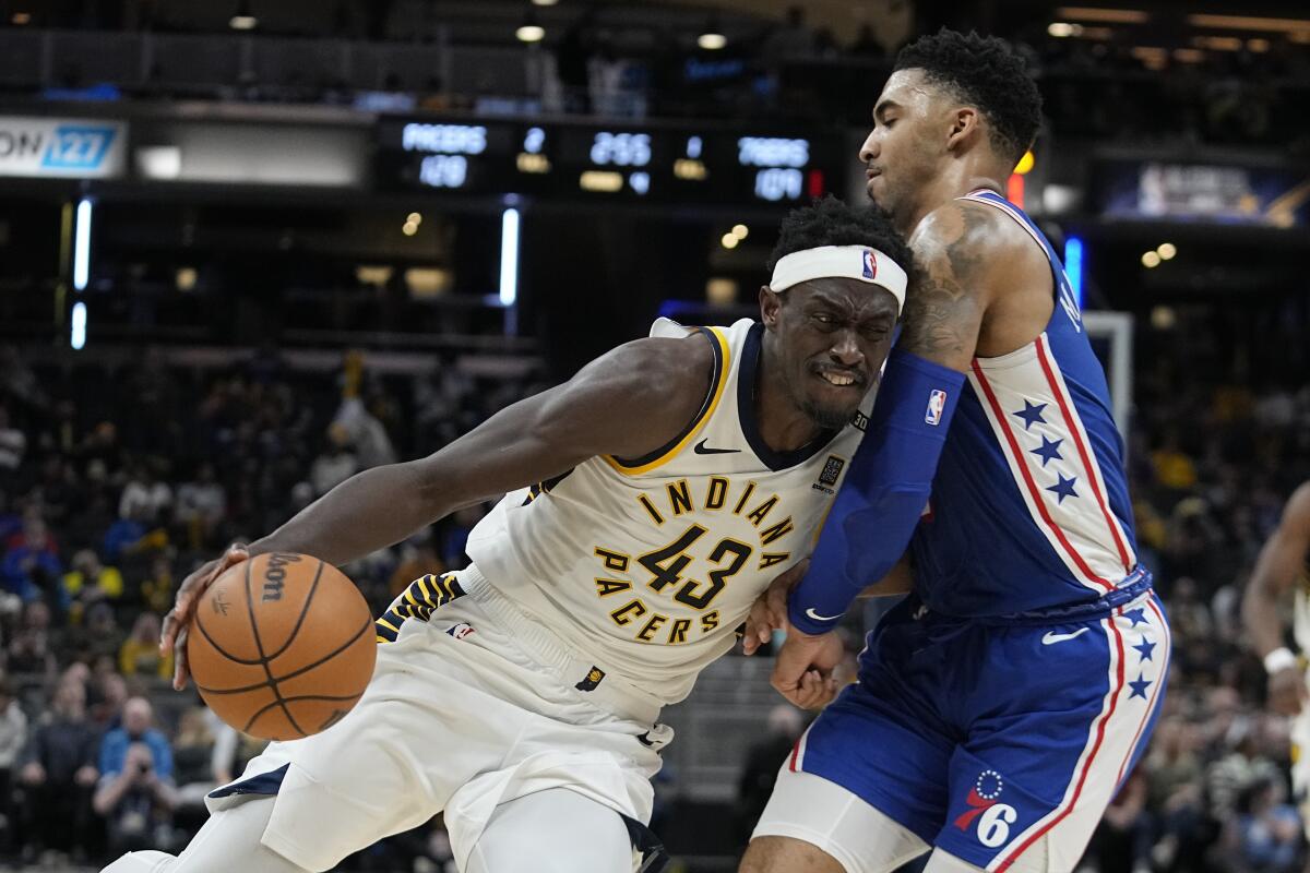 Indiana Pacers' Pascal Siakam (43) goes to the basket against Philadelphia 76ers' KJ Martin during the second half of an NBA basketball game Thursday, Jan. 25, 2024, in Indianapolis. (AP Photo/Darron Cummings)