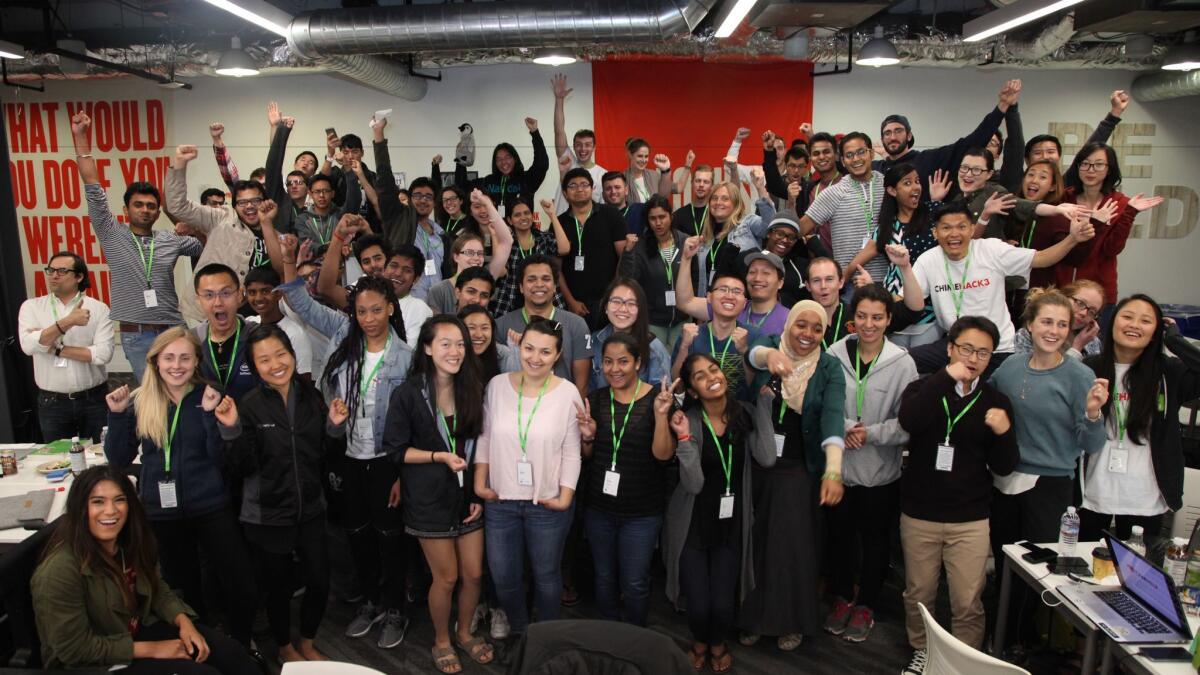 Chimehack 3 participants celebrate their completed projects at Facebook Headquarters on August 27, 2016 in Menlo Park, California.