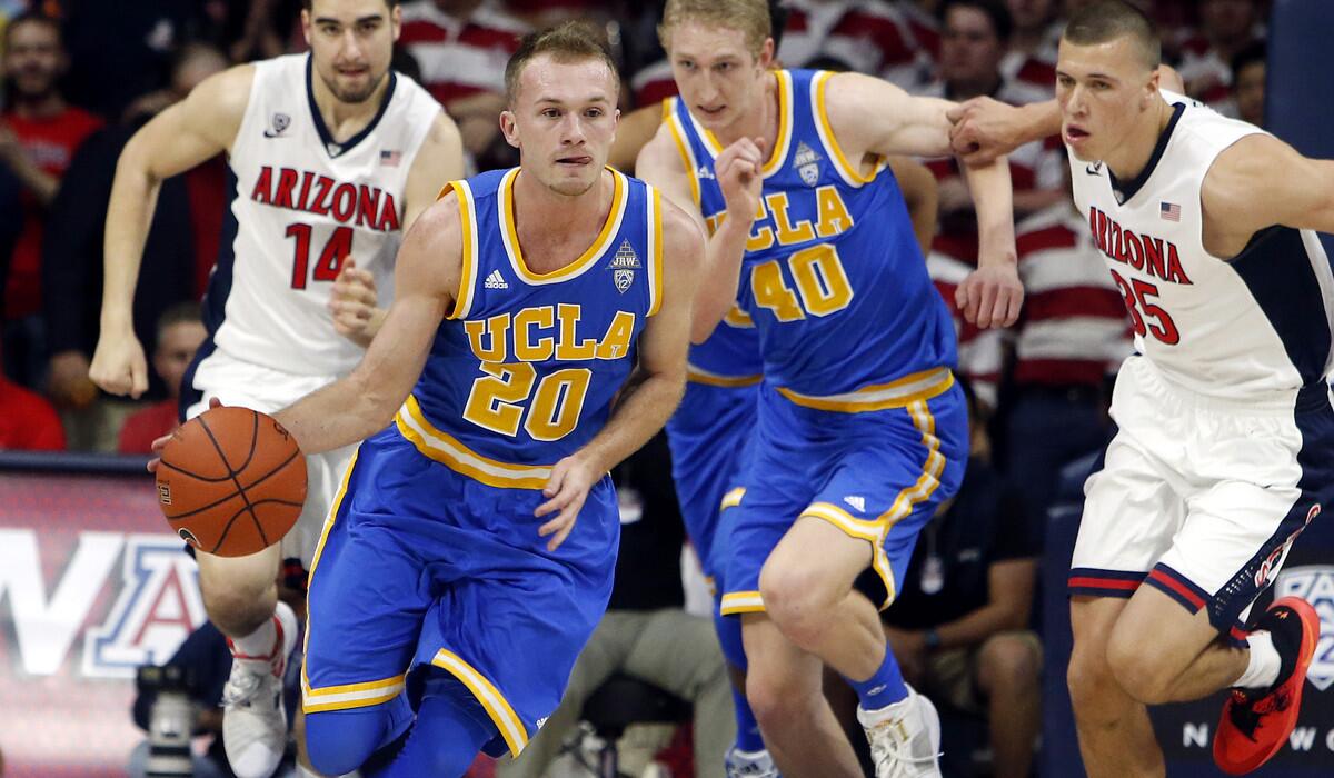 UCLA guard Bryce Alford (20) brings the ball up against against Arizona during the first half on Friday.