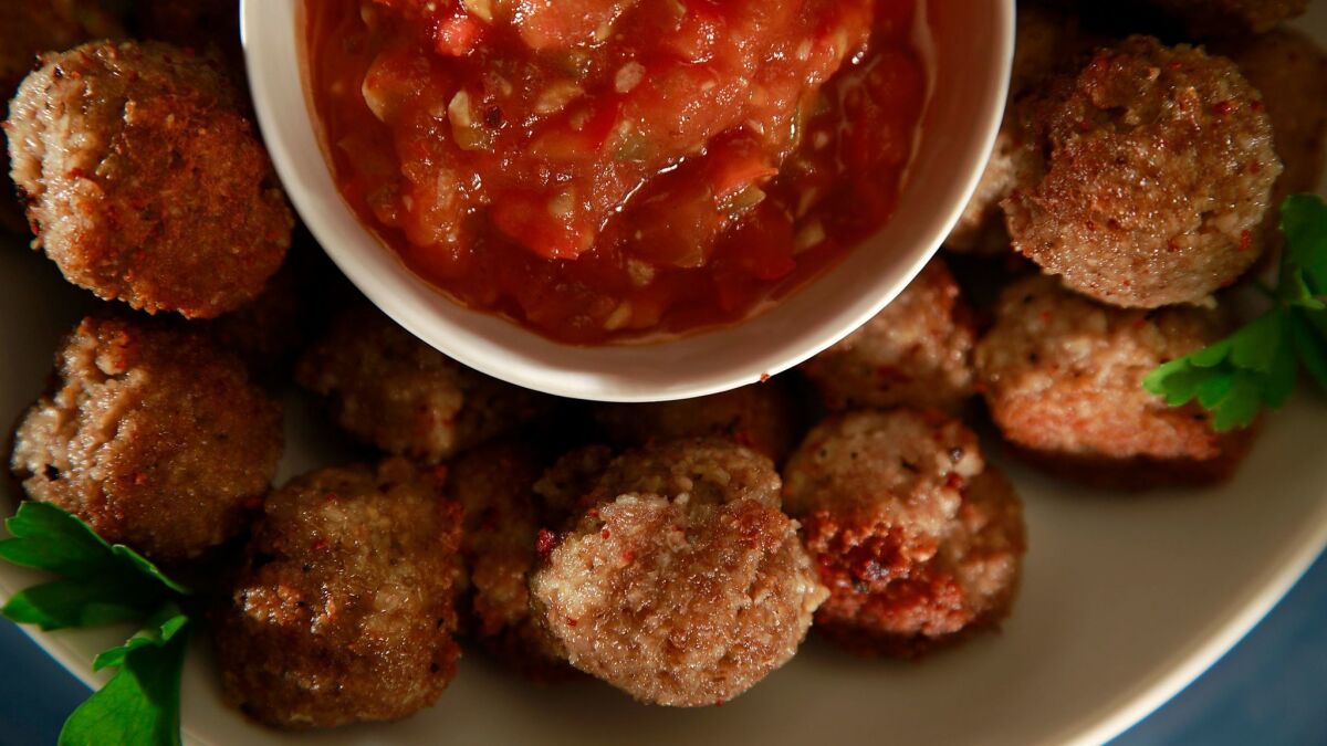 Bulgur meatballs with tomato pepper sauce.
