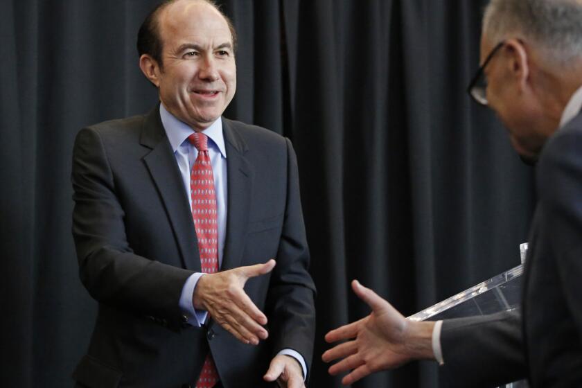 Viacom released its fiscal first-quarter earnings Tuesday, nearly a week after Viacom board members elected CEO Philippe Dauman to serve as chairman of the media company. Here, Dauman, left, greets Sen. Charles Schumer (D-New York) in 2014.