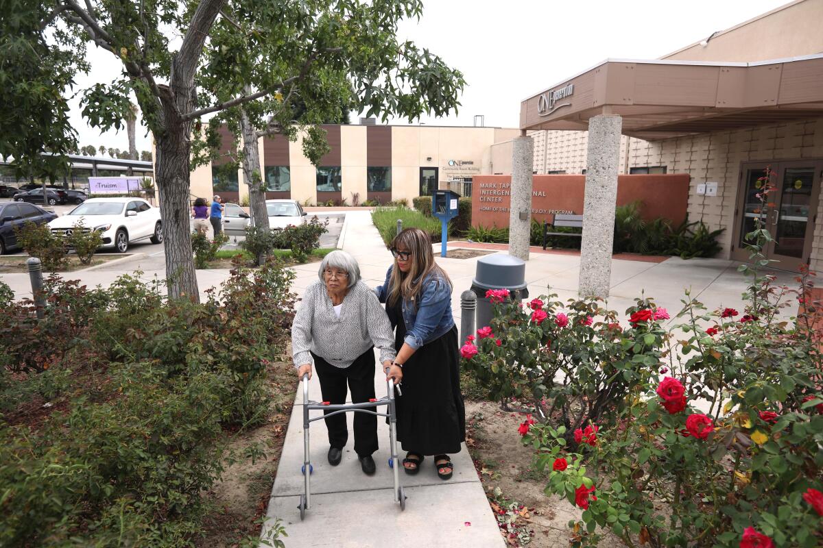 Mariella Rojas picks up her mother, Rosa Angelica Saldana, from OneGeneration Adult Day Care