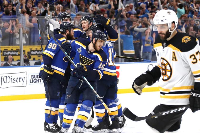 ST LOUIS, MISSOURI - JUNE 03: Brayden Schenn #10 of the St. Louis Blues celebrates his empty-net goal in the third period at 18:31 as Patrice Bergeron #37 of the Boston Bruins looks on in Game Four of the 2019 NHL Stanley Cup Final at Enterprise Center on June 03, 2019 in St Louis, Missouri. (Photo by Bruce Bennett/Getty Images) ** OUTS - ELSENT, FPG, CM - OUTS * NM, PH, VA if sourced by CT, LA or MoD **