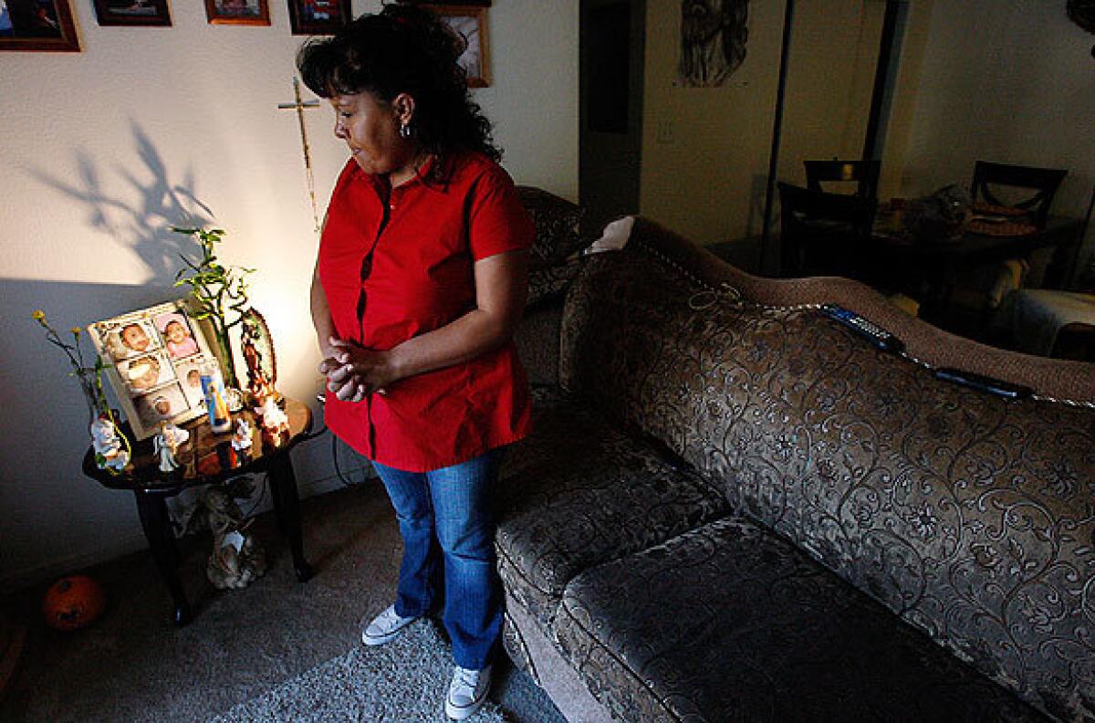 Maria Saulcedo, 41, stands beside a memorial to her daughter Ashley, who was born with a cleft palate and other health problems. Ashley was one of five babies born with cleft palates in the tiny San Joaquin Valley community of Kettleman City during a 14-month span beginning in September 2007. Ashley was 11 months old when she died.