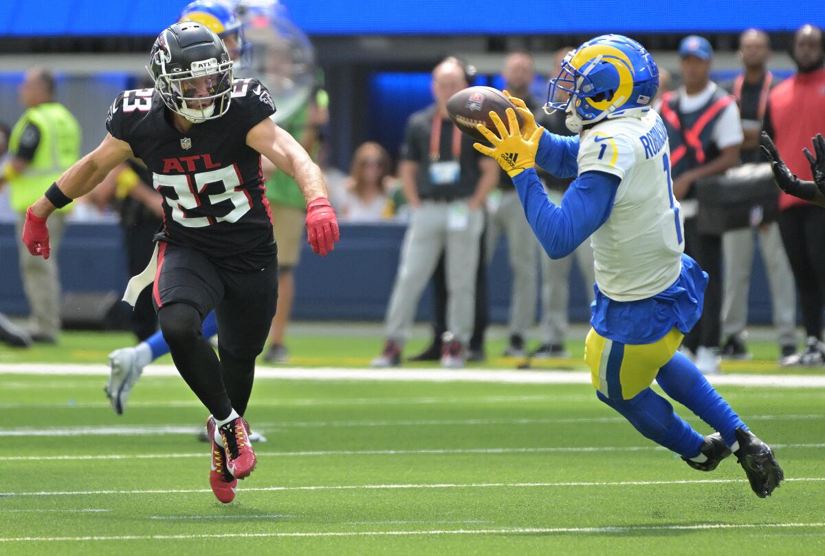 Rams receiver Allen Robinson makes a catch in front of Falcons safety Erik Harris in the second quarter.