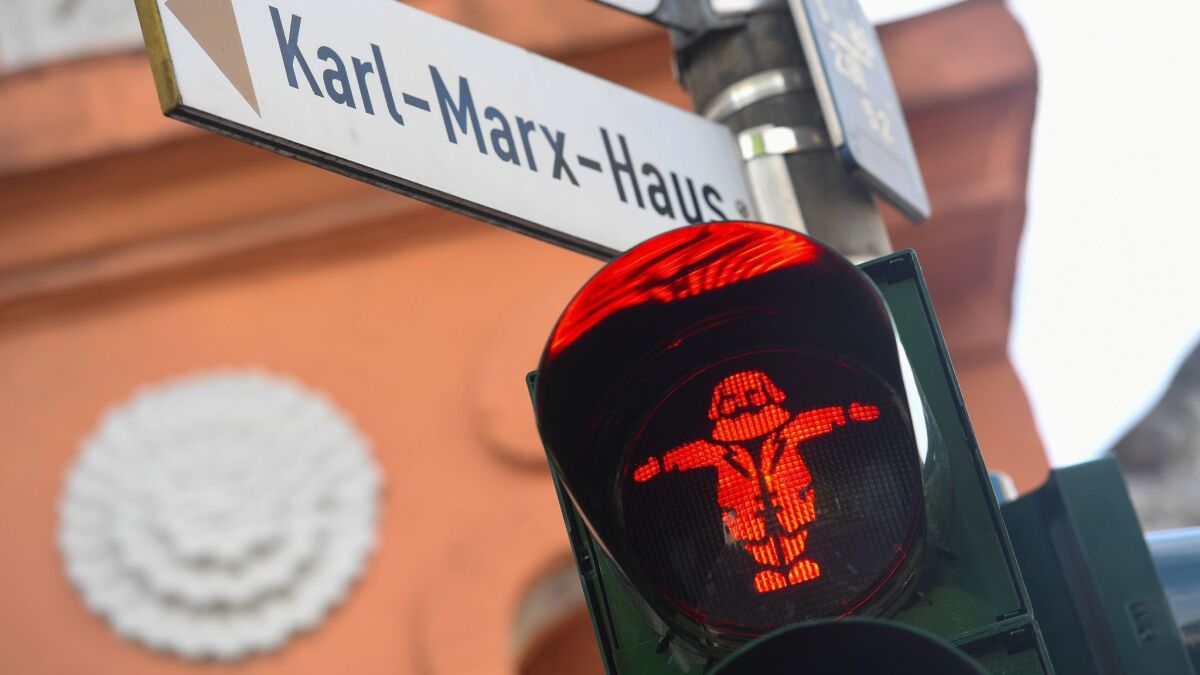 A pedestrian traffic light in Tier, Germany, features native son Karl Marx.