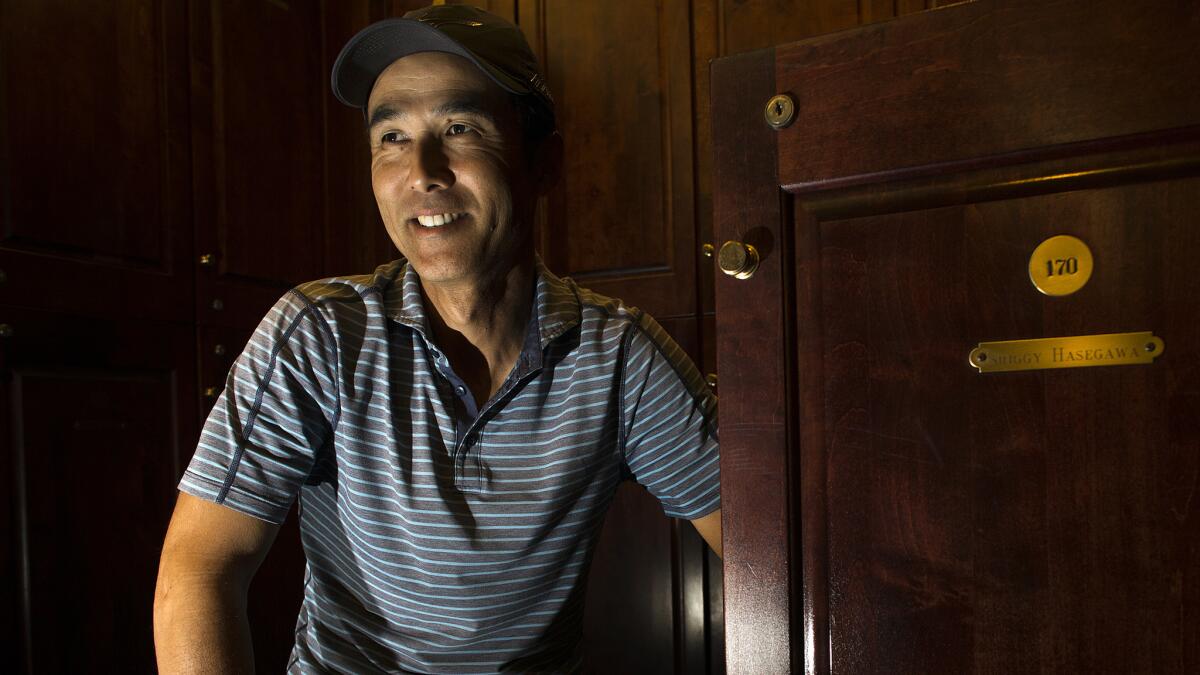 Shigetoshi Hasegawa sits by his locker at Mission Viejo Country Club, where he's been practicing for the U.S. Amateur golf championship.