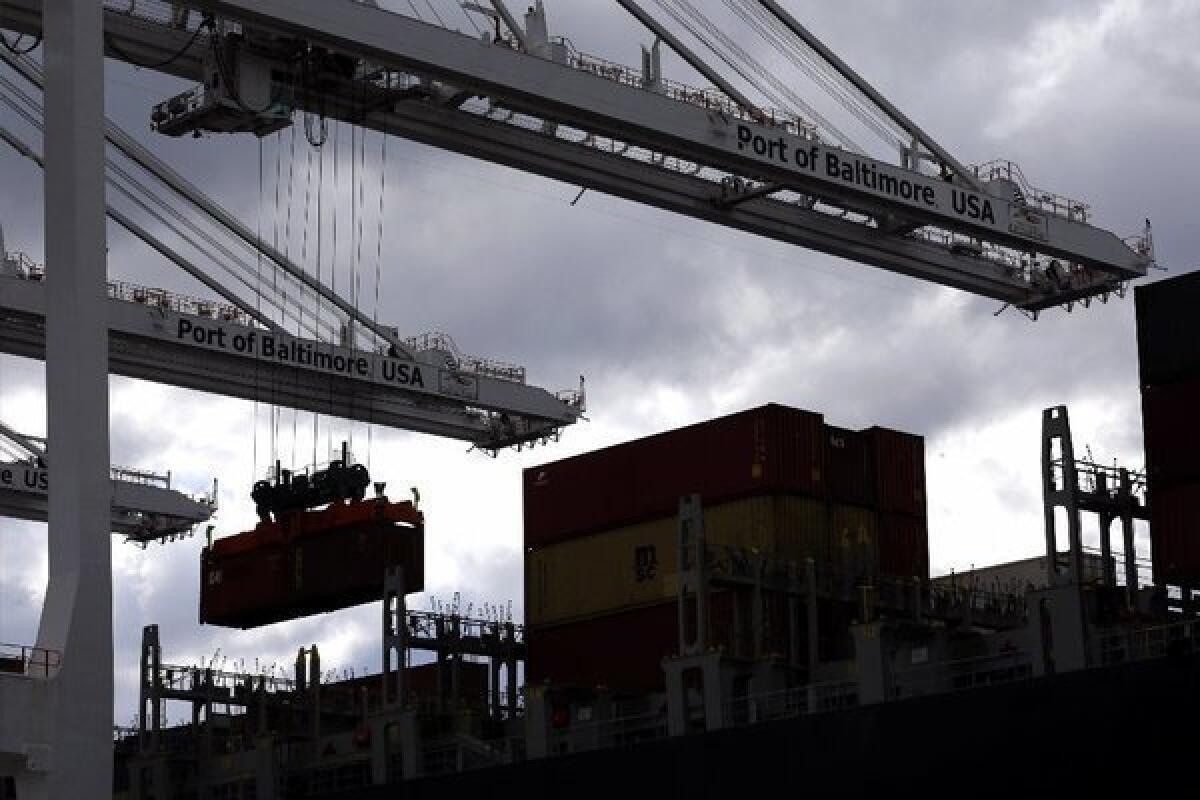 A crane removes a container from a ship at the Port of Baltimore's Seagirt Marine Terminal.