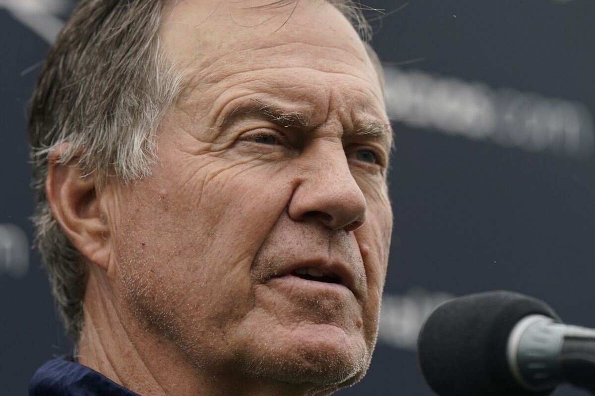 New England Patriots head coach Bill Belichick faces reporters at an NFL football practice, Monday, Aug. 9, 2021, in Foxborough, Mass. (AP Photo/Steven Senne)