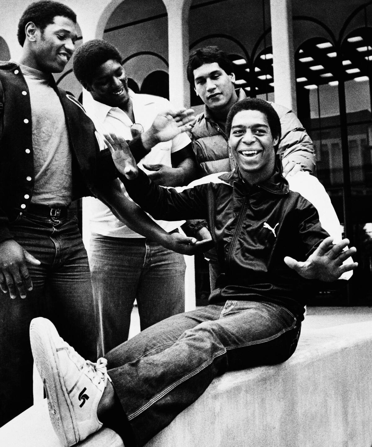 USC's Marcus Allen sits and jokes around with teammates Dennis Edwards, Byron Darby and George Achica in 1981