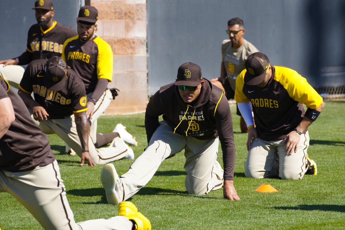 Manny Machado stretches with teammates at spring training.