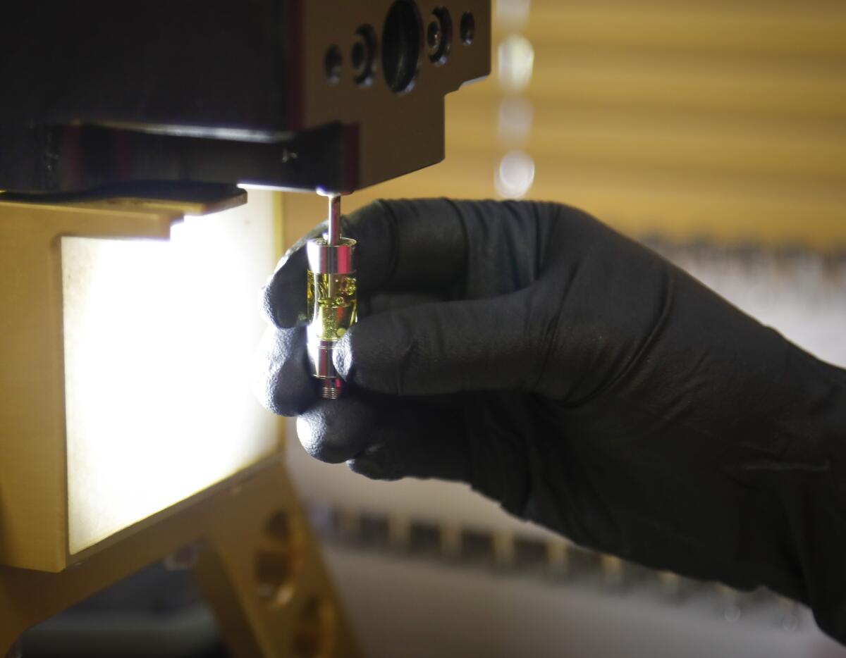 Damaris Rabadan fills vape Platinum Vape cartridges on Oct. 10 at its Kearny Mesa facility.