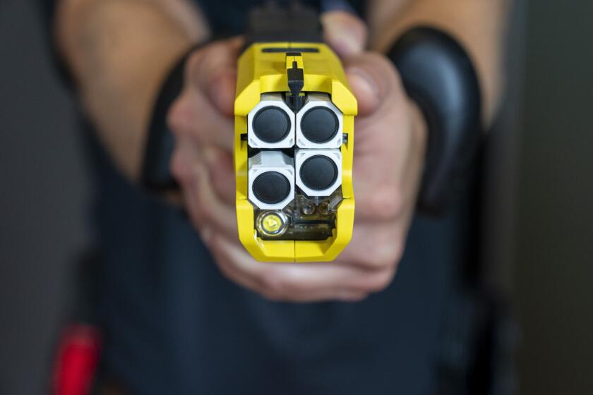 VR equipment and a version of the TASER 7 that utilizes VR technology for training, is demonstrated, Thursday, May 12, 2022, in Washington. Axon, the company that is best known for developing the Taser, is expanding virtual reality and immersive training in an effort to encourage police officers across the U.S. to more regularly train with less-than-lethal weapons. (AP Photo/Jacquelyn Martin)