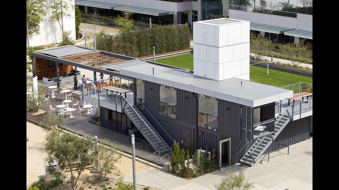 Shipping containers are the main structure surrounded by various outdoor activities at Intersect, an office development in Irvine.