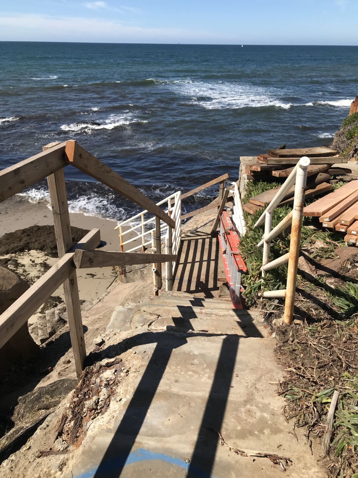 The beach access stairs at Bermuda Avenue are pictured March 9 as repairs progress.