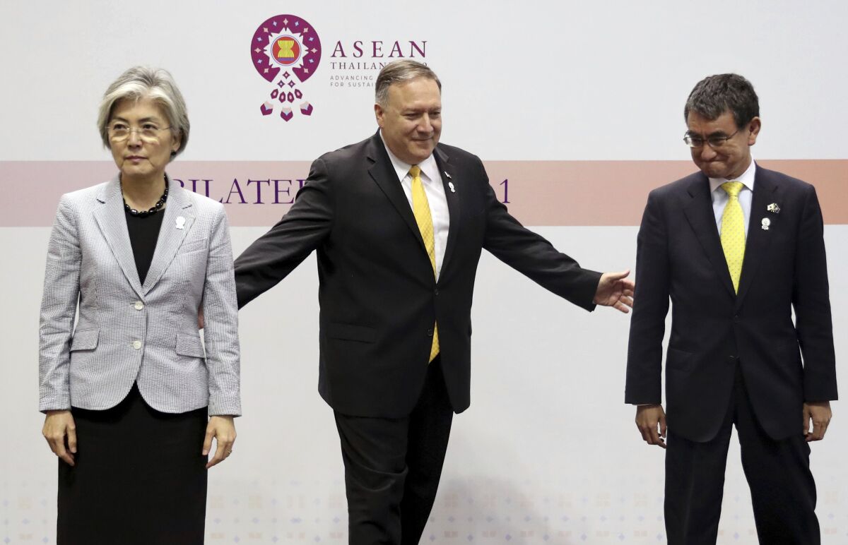 Kang Kyung-wha of South Korea, left, Mike Pompeo, and Taro Kono of Japan at the ASEAN foreign ministers' meeting in Bangkok, Thailand, on Aug. 2.