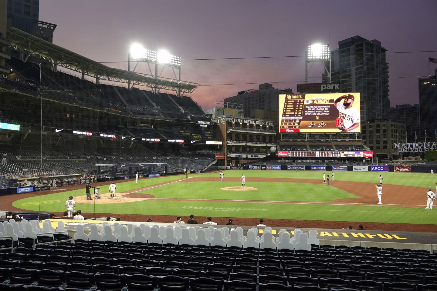 The sun sets as the San Diego Padres play the Colorado Rockies at Petco Park on Wednesday, Sept. 9, 2020.