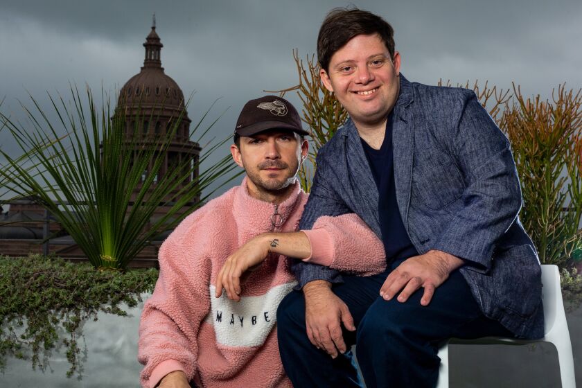 Shia LaBeouf and Zack Gottsagen pose on a rooftop during South by Southwest in downtown Austin, Texas, Sunday, March 10, 2019. The pair premiered their film 'The Peanut Butter Falcon' at the SXSW film festival on Saturday. (Stephen Spillman / for Los Angeles Times)