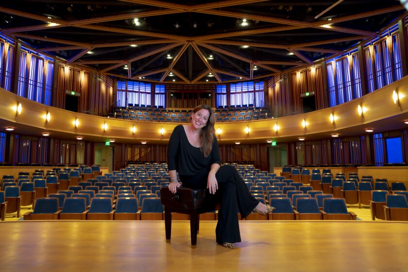 Leah Rosenthal, artistic director of the La Jolla Music Society on stage at the Baker-Baum Concert Hall.  The theater has been closed since the beginning of the coronavirus pandemic.