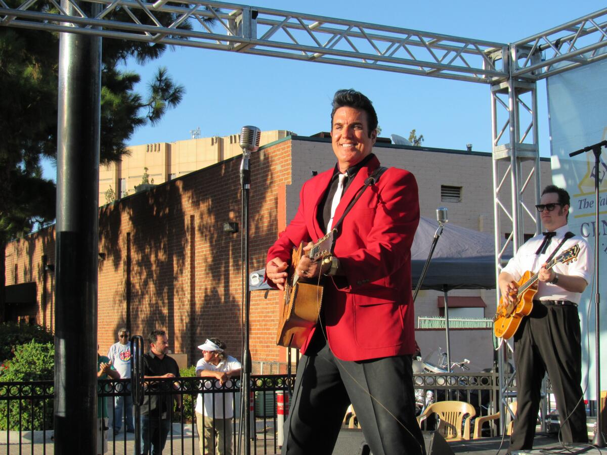 Scot Bruce and the Elvis Tribute band perform "Blue Suede Shoes" in 2019 at Prescott Promenade in El Cajon.