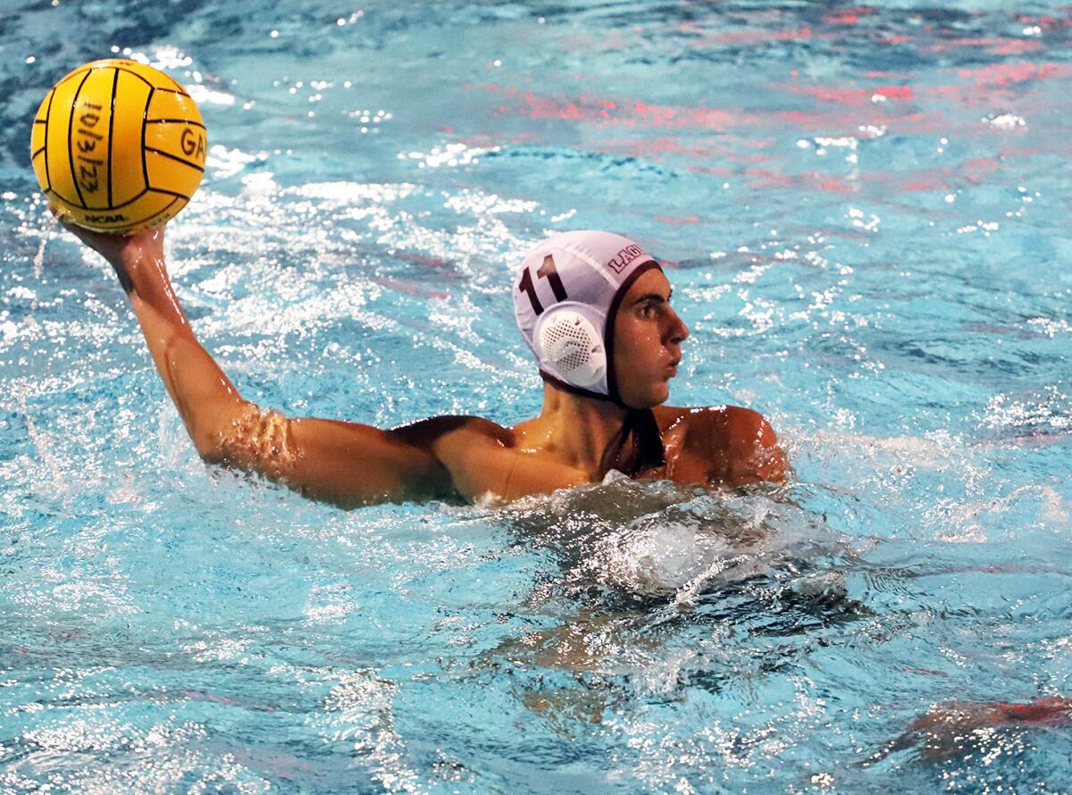 Laguna Beach's Luke Harrison (11) looks for a pass against Foothill.