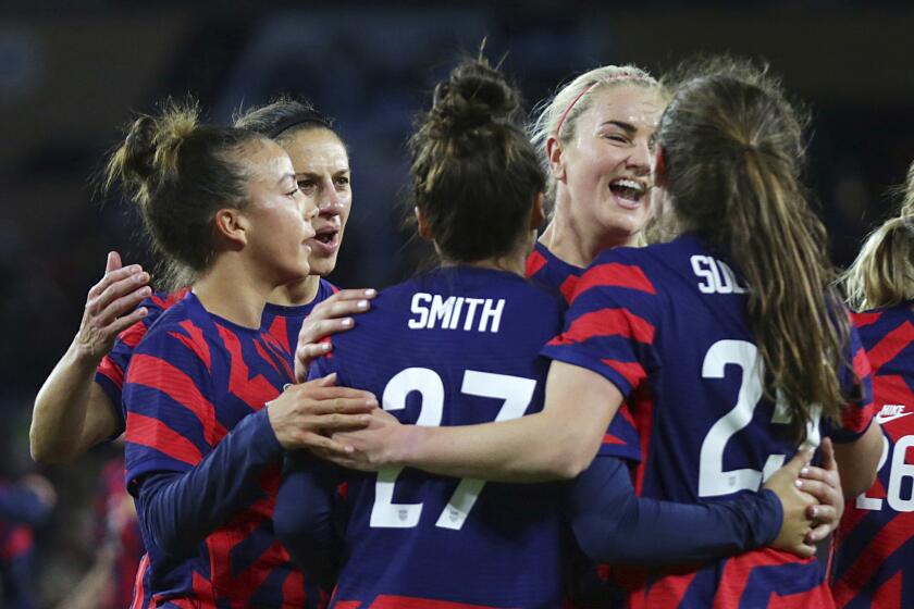 United States players celebrate a goal by Andi Sullivan (25) including, left to right, Mallory Pugh, Carli Lloyd, Sophia Smith (27) and Lindsey Horan against South Korea in the first half of a soccer friendly match Tuesday, Oct. 26, 2021, in St. Paul, Minn. (AP Photo/Andy Clayton-King)
