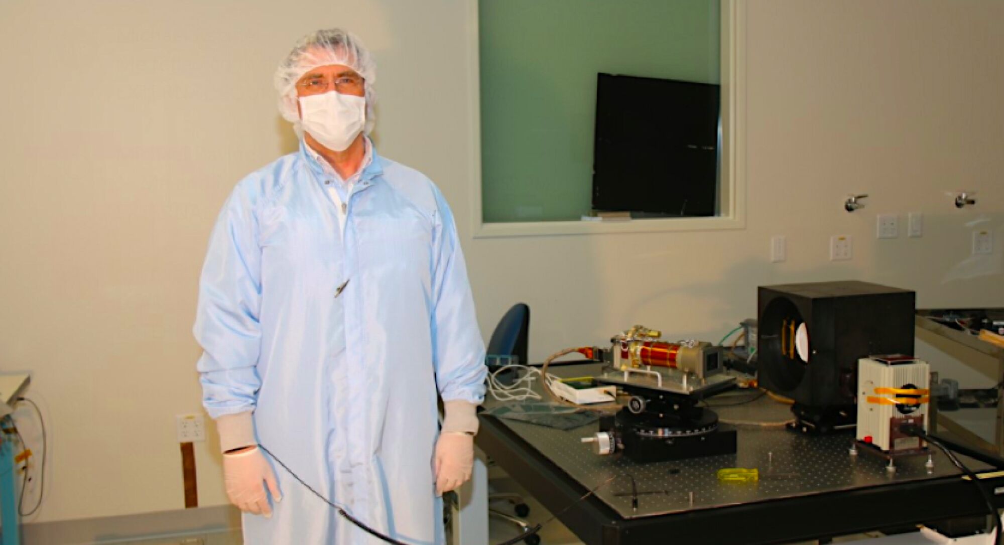 Mike Ravine, advanced project manager at MSSS, stands next to a Mastcam-Z camera.