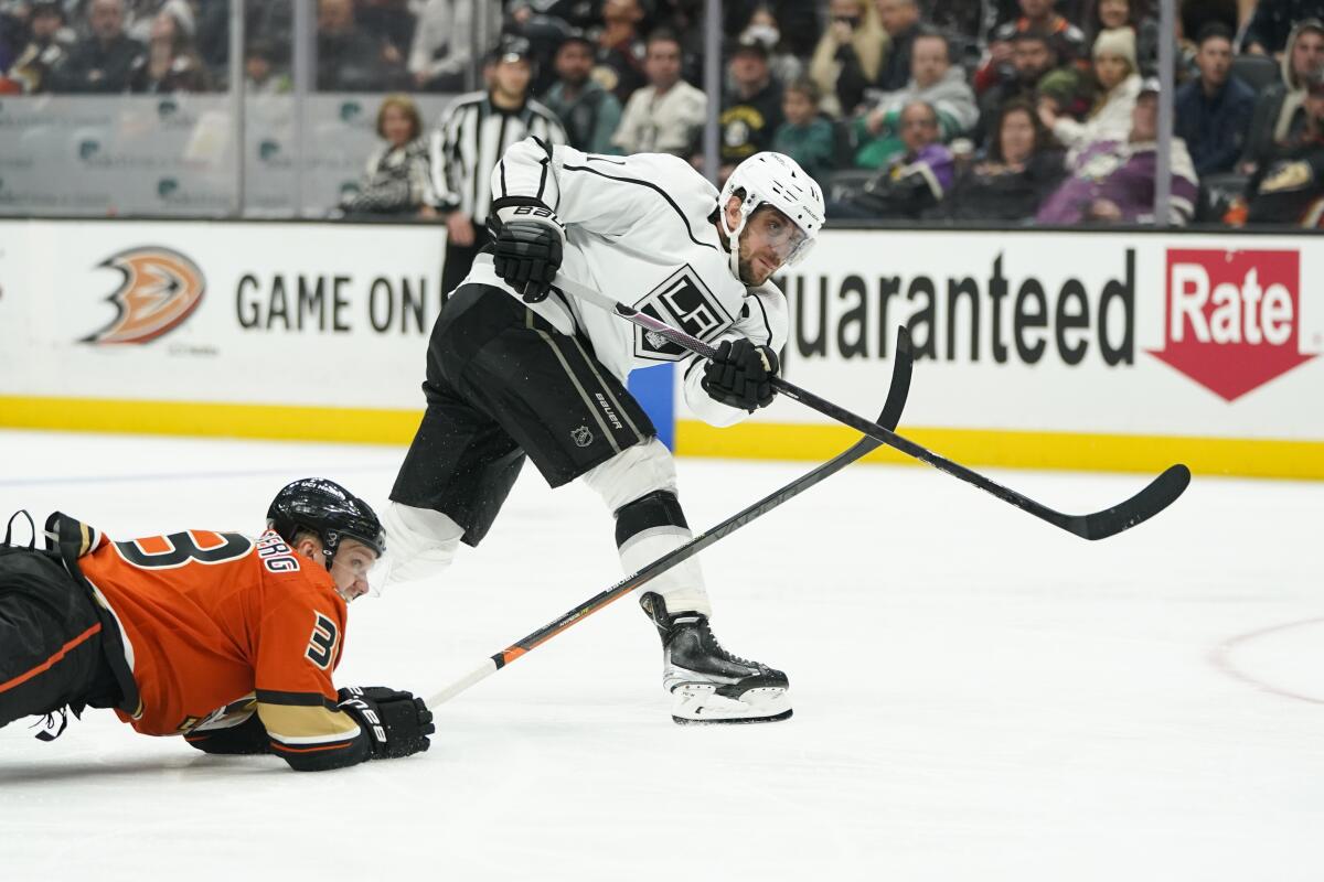 Kings forward Anze Kopitar shoots in front of Ducks forward Jakob Silfverberg during the third period.