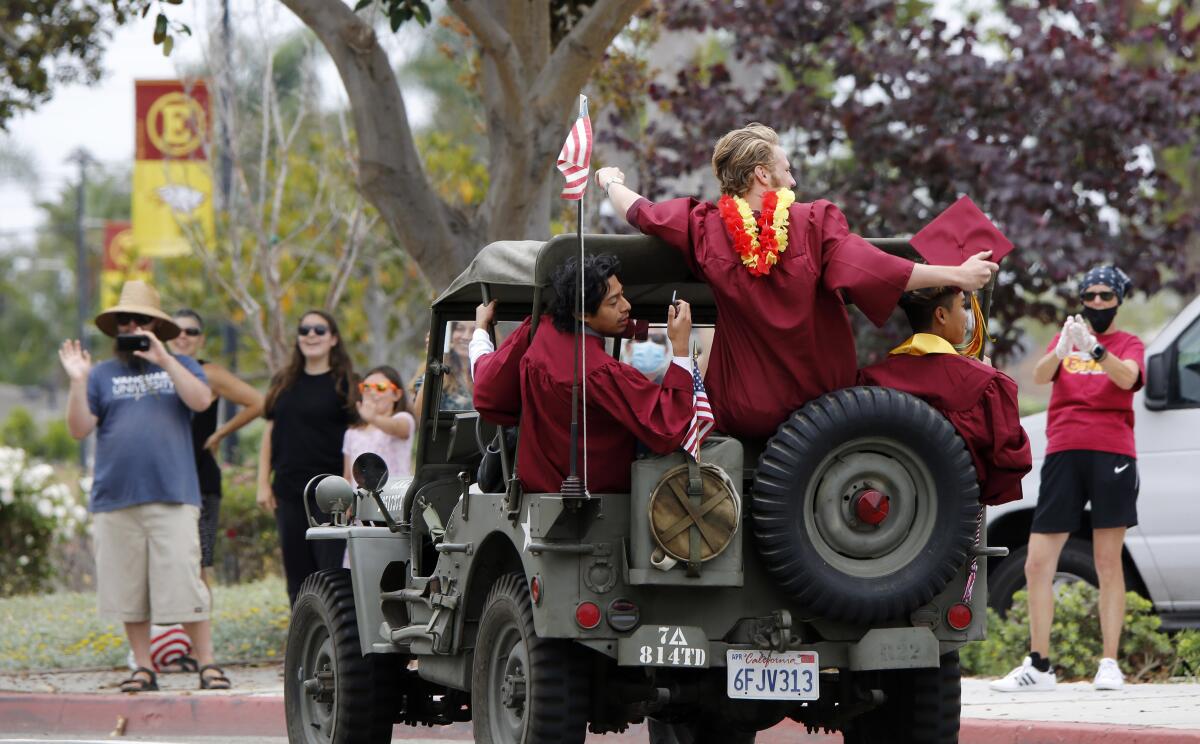 Estancia High School grads waved at crowds waiting for them toward the end of the parade.