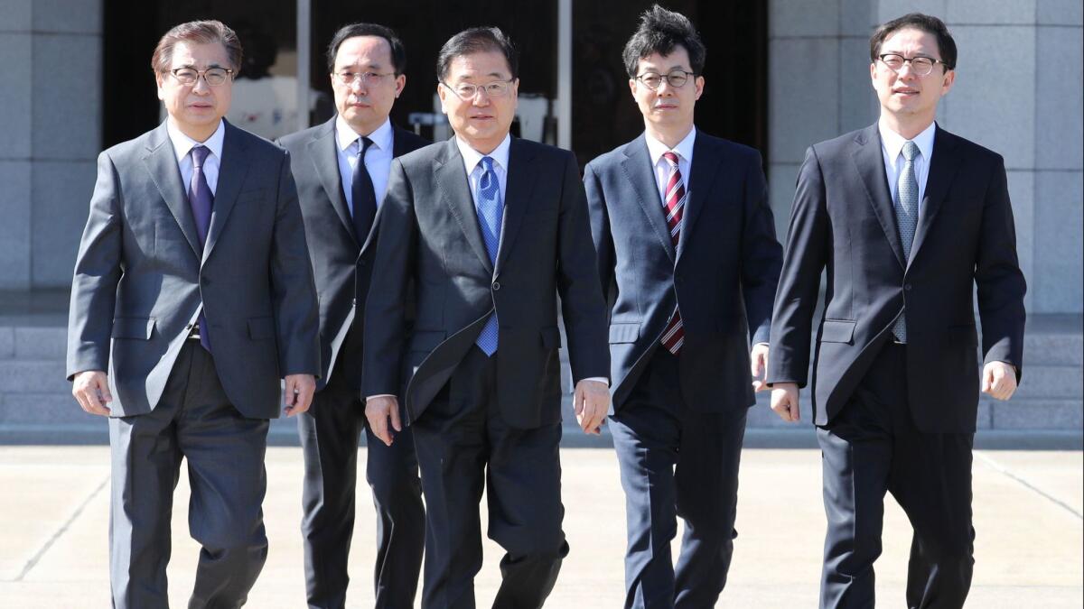 Chung Eui-yong, third from left, the chief of the presidential National Security Office, departs for Pyongyang with other members of South Korea's envoy delegation.