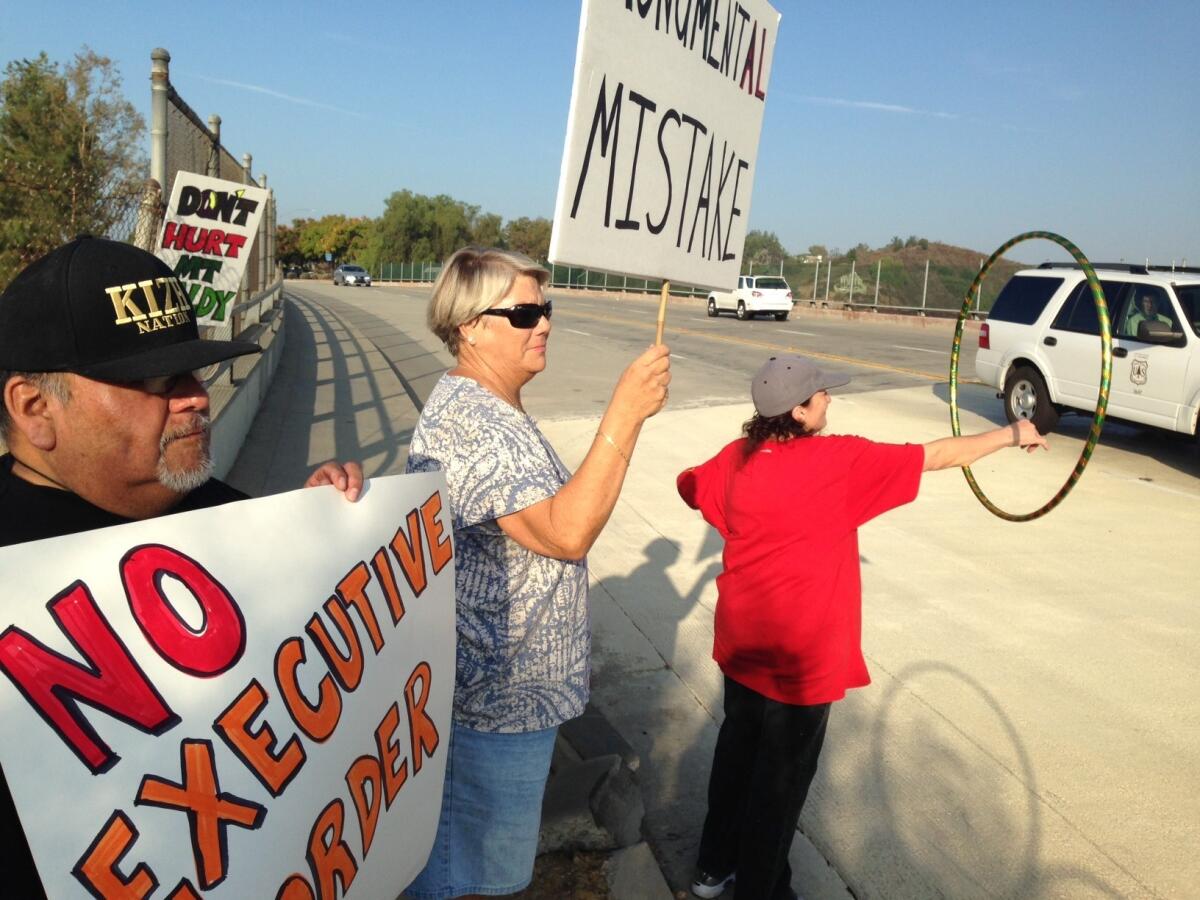 Protesters gathered in San Dimas early Friday ahead of President Obama's speech announcing the designation of San Gabriel Mountains National Monument.