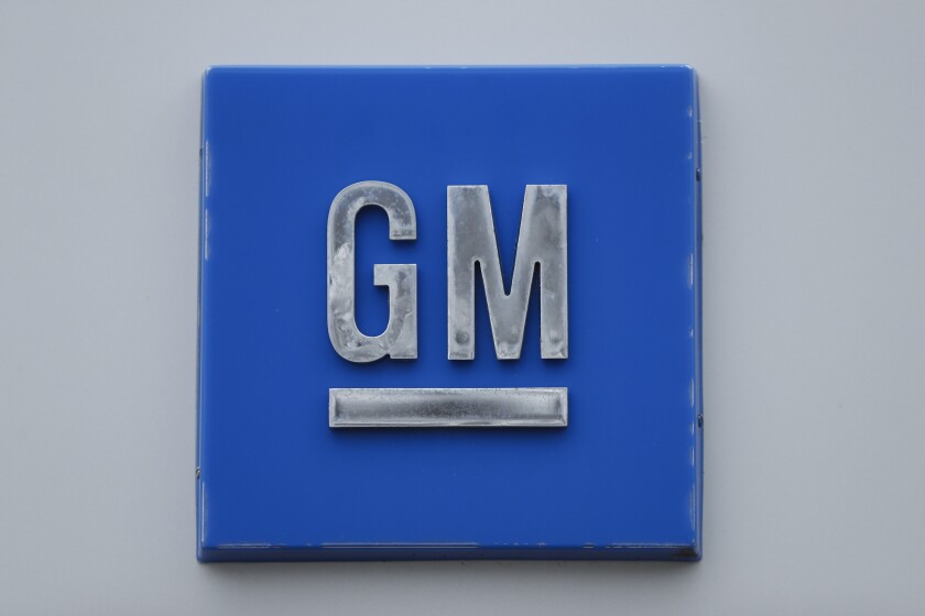 FILE - A GM logo is shown at the General Motors Detroit-Hamtramck Assembly plant in Hamtramck, Mich., Jan. 27, 2020. General Motors and a joint venture partner plan to build an electric vehicle battery factory in Lansing, Michigan, which would be their third such factory in the U.S. The companies' plans were revealed in documents posted on the city’s website Friday, Dec. 10, 2021. (AP Photo/Paul Sancya, file)