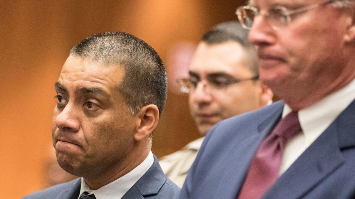 L.A. school board member Ref Rodriguez, left, appears in court this month with his attorney, Daniel V. Nixon. (Brian van der Brug / Los Angeles Times)