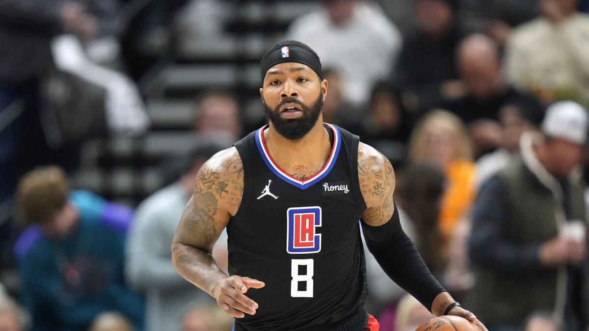 Clippers forward Marcus Morris Sr. (8) brings the ball upcourt.