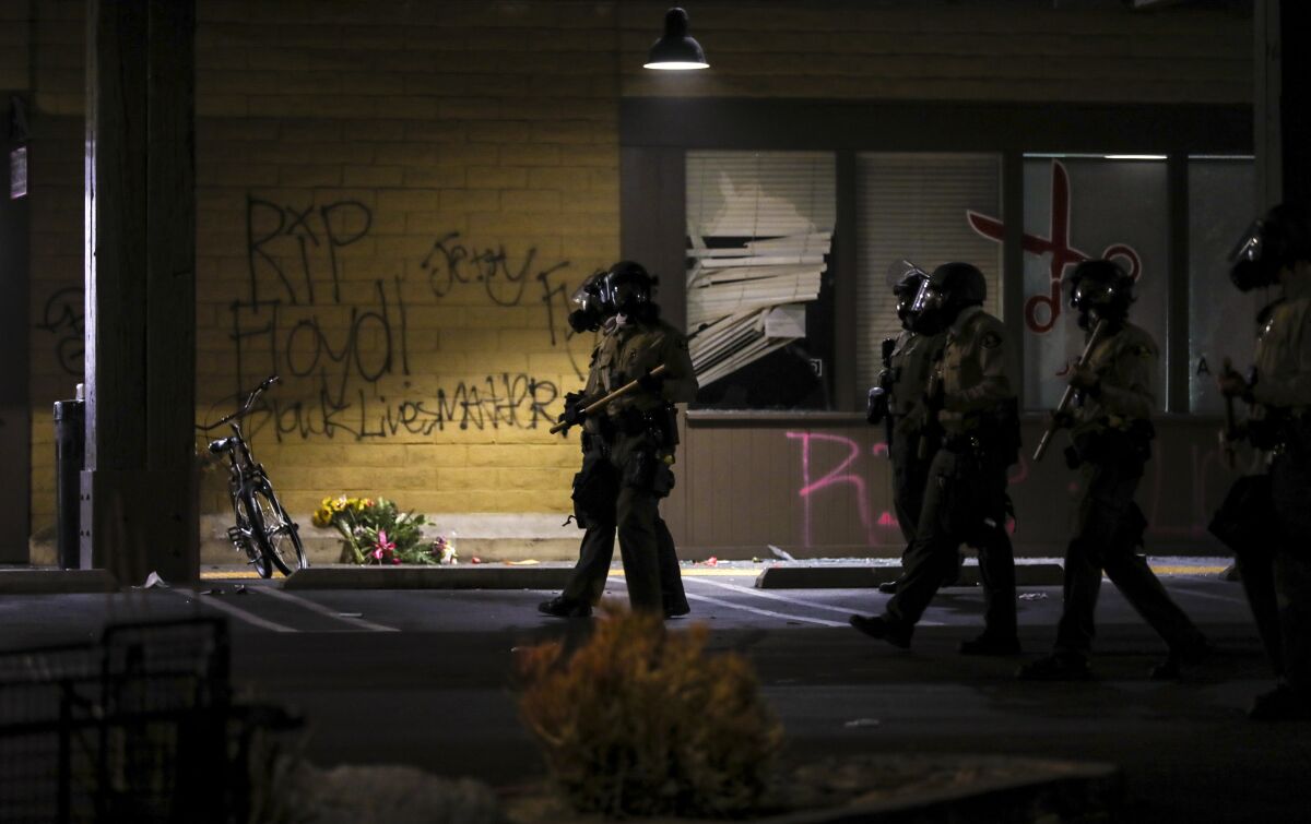 After a Vons and a sports store had been set on fire on Saturday night, May 30, 2020, San Diego County sheriff's deputies moved to clear out protesters in the city of La Mesa.