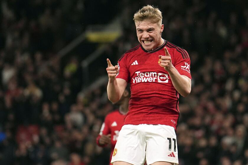 Manchester United's Rasmus Hojlund celebrates scoring their side's fourth goal of the game during the English Premier League soccer match between Manchester United and Sheffield at the Old Trafford Stadium in Manchester, England, Wednesday, April 24, 2024. (Martin Rickett/PA via AP)