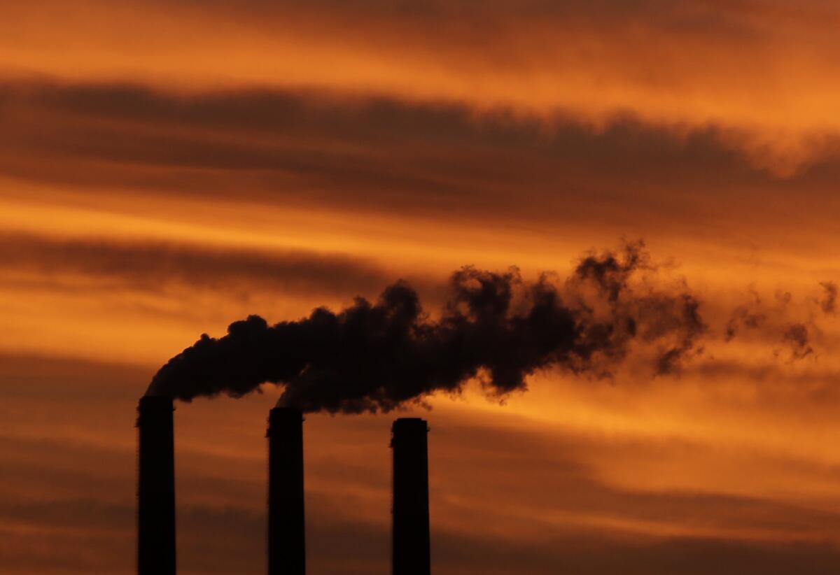 Smoke billows from smokestacks near Emmett, Kansas. 