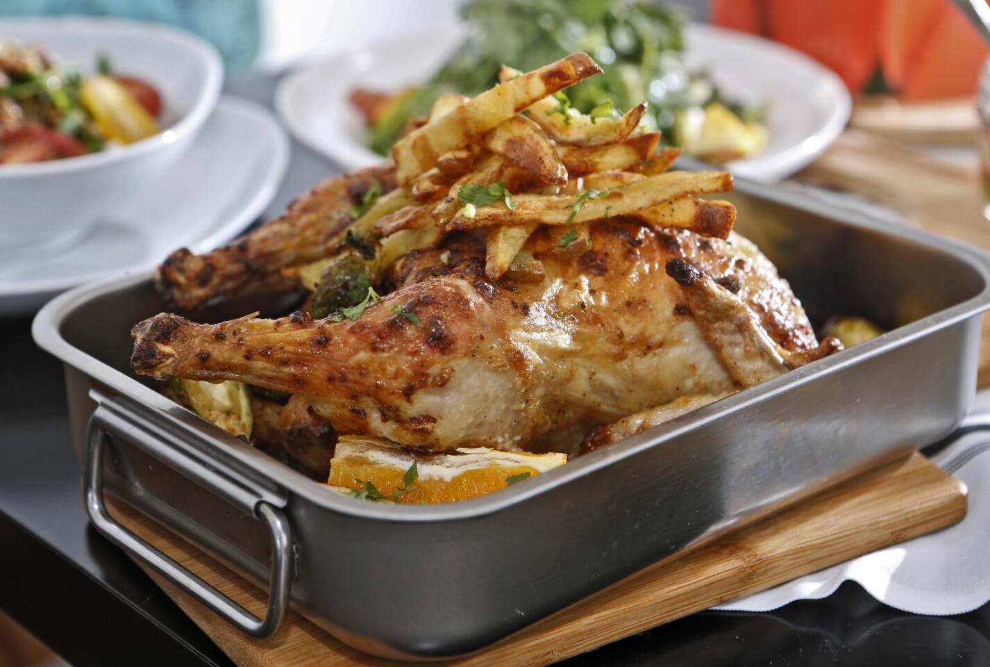 Heritage Eatery's oven-baked chicken with french fries.