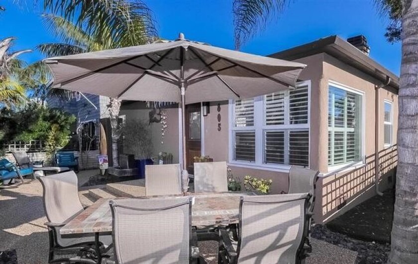 This South Mission Beach home on Brighton Court is among a number of properties being marketed for sale by a court-appointed receiver in the Gina Champion-Cain fraud case.