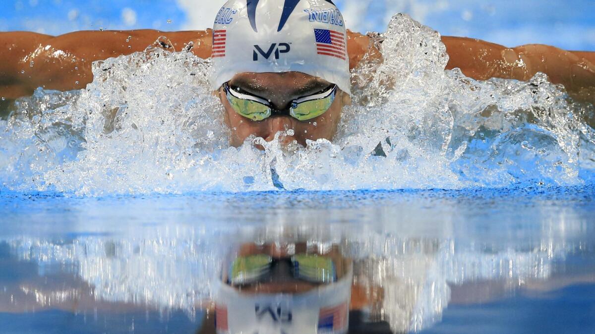Michael Phelps swims in the men's 200-meter butterfly final.