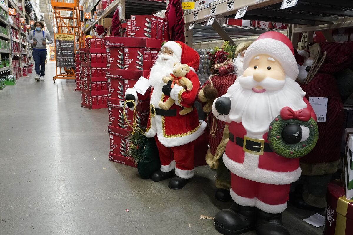 Santa Claus figures at a Home Depot store in Boston