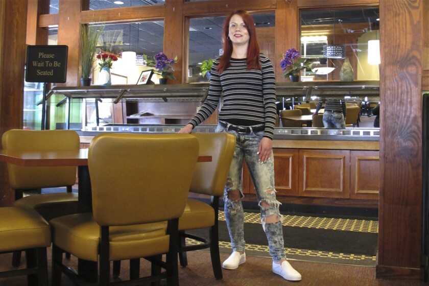 Courtney Keith in the restaurant that let her go after Ohio banned sit-down dining.